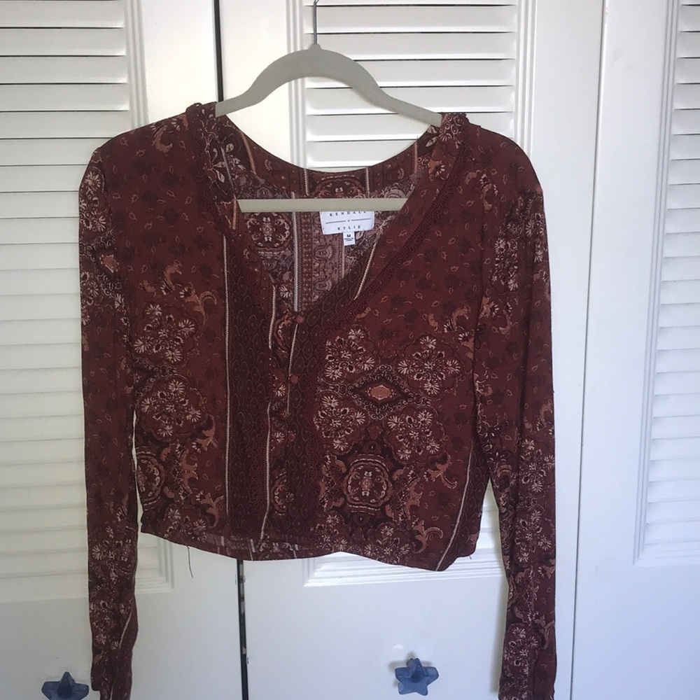 A cute red with design, long sleeved crop top